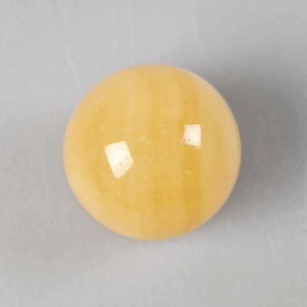 Orange Calcite sphere | 4 cm